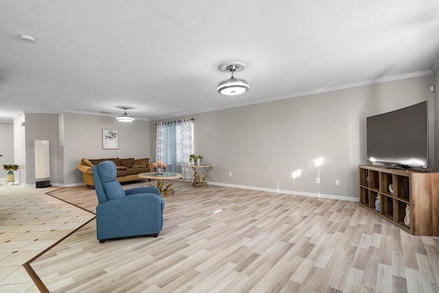 living room featuring ornamental molding and light wood-type flooring