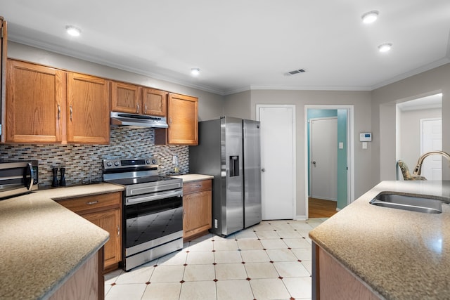 kitchen featuring stainless steel appliances, ornamental molding, sink, and decorative backsplash