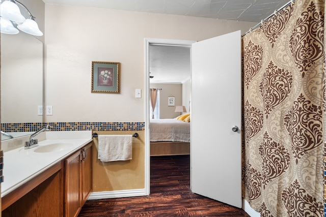 bathroom with hardwood / wood-style flooring and vanity