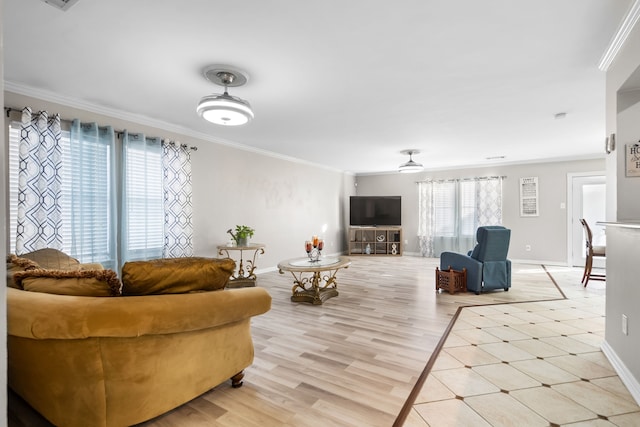 living room featuring crown molding, light hardwood / wood-style flooring, and ceiling fan