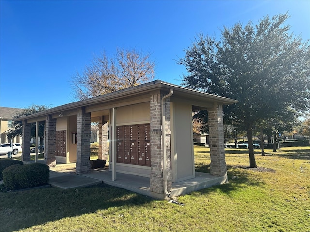 surrounding community featuring a yard and mail boxes