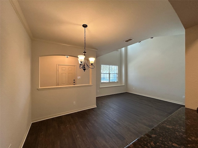 interior space with dark hardwood / wood-style flooring, ornamental molding, and a chandelier