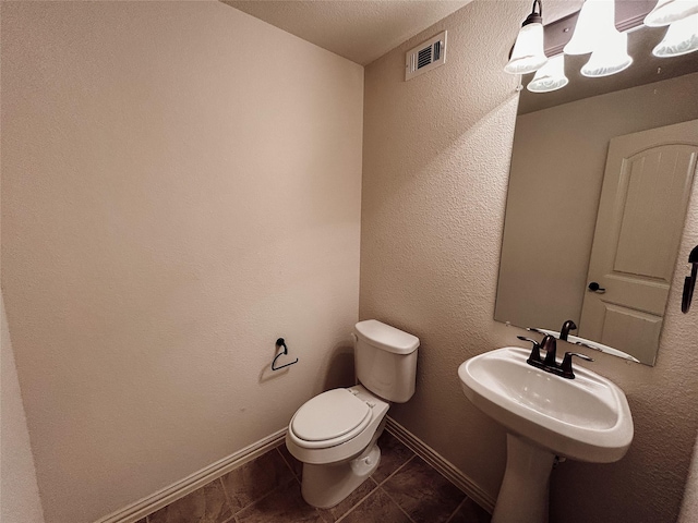 bathroom featuring toilet