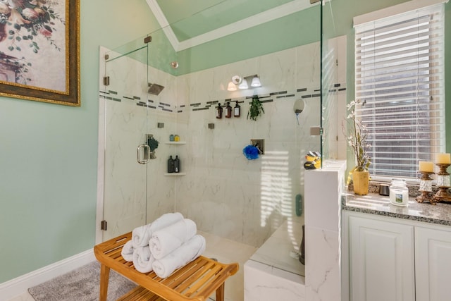 bathroom with ornamental molding and a shower with shower door