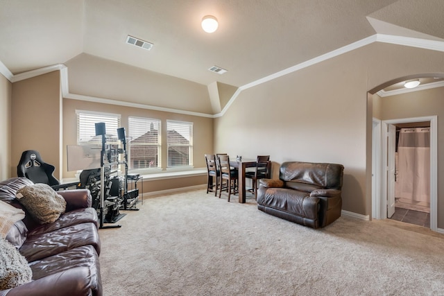 carpeted living room with vaulted ceiling and crown molding