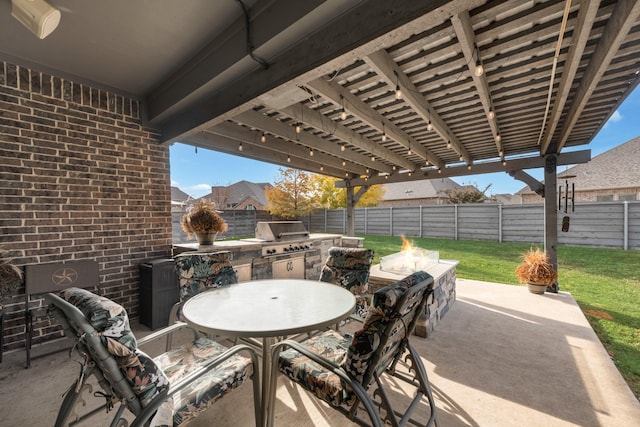 view of patio / terrace featuring area for grilling, a grill, and an outdoor fire pit