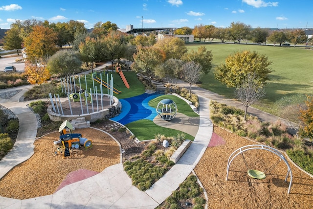 exterior space with a playground and a yard