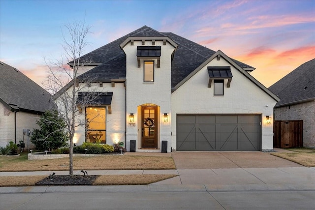 view of front of property featuring a garage