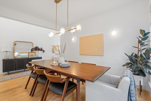 dining area featuring light wood-type flooring