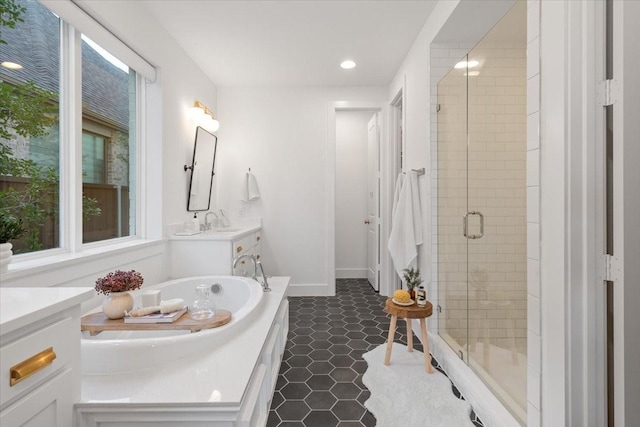 bathroom with separate shower and tub, tile patterned floors, and vanity