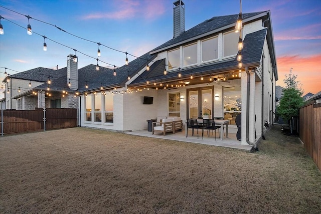 back of house featuring a patio, an outdoor hangout area, and ceiling fan