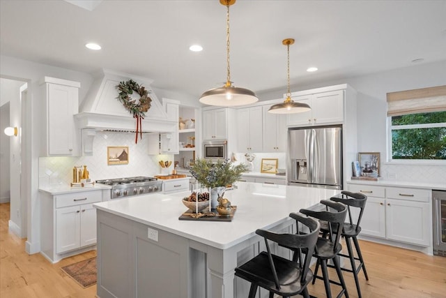 kitchen featuring white cabinetry and appliances with stainless steel finishes