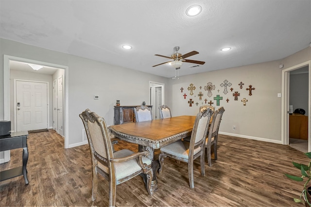 dining space featuring dark hardwood / wood-style floors and ceiling fan