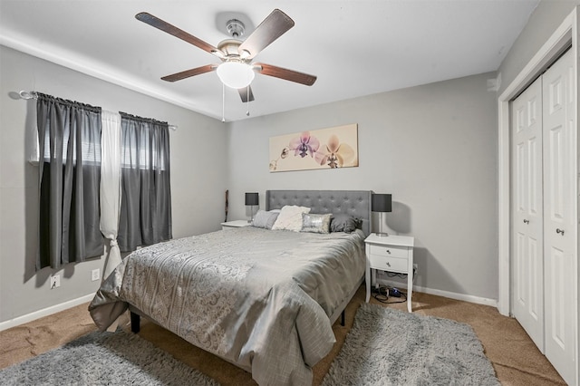 bedroom with light carpet, a closet, and ceiling fan