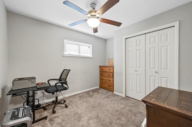 home office with ceiling fan and light carpet