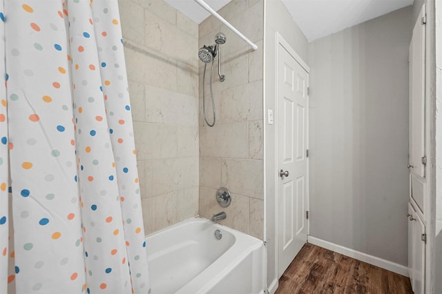 bathroom featuring shower / bathtub combination with curtain and wood-type flooring