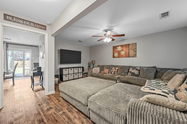 living room with hardwood / wood-style floors and ceiling fan