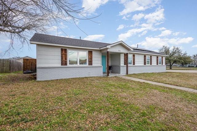 ranch-style home with a front lawn