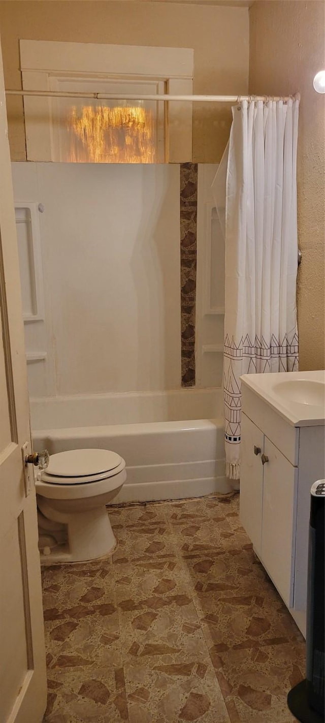 full bathroom featuring shower / bath combo with shower curtain, vanity, and toilet