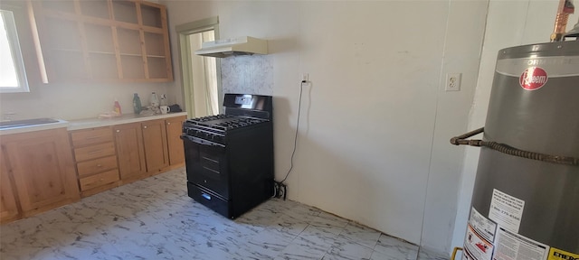 kitchen featuring black range with gas stovetop, sink, range hood, and water heater