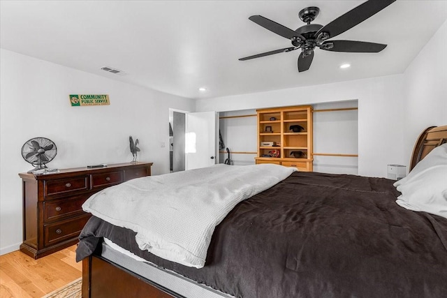 bedroom with ceiling fan and light wood-type flooring