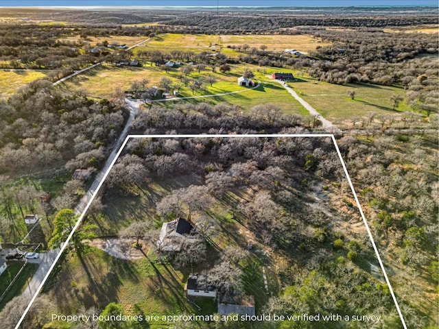 birds eye view of property featuring a rural view