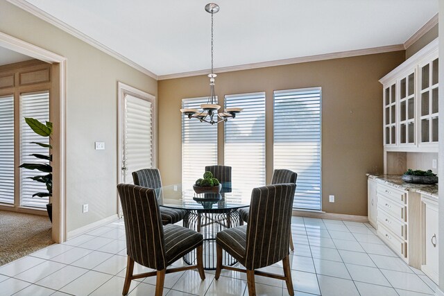 tiled dining area with a chandelier and ornamental molding