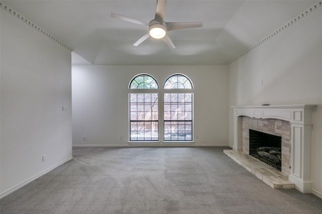 unfurnished living room with light carpet, a fireplace, ceiling fan, and lofted ceiling