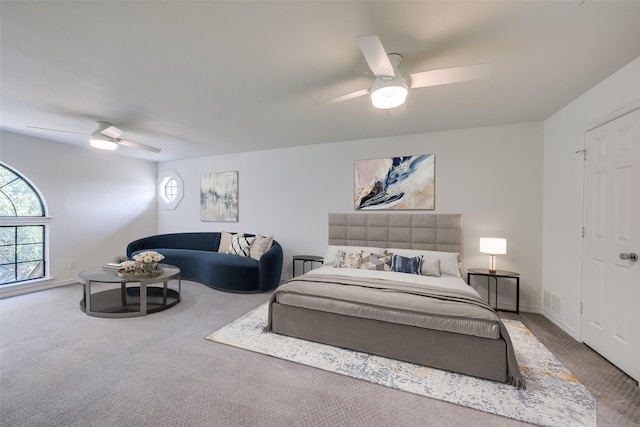 carpeted bedroom with ceiling fan