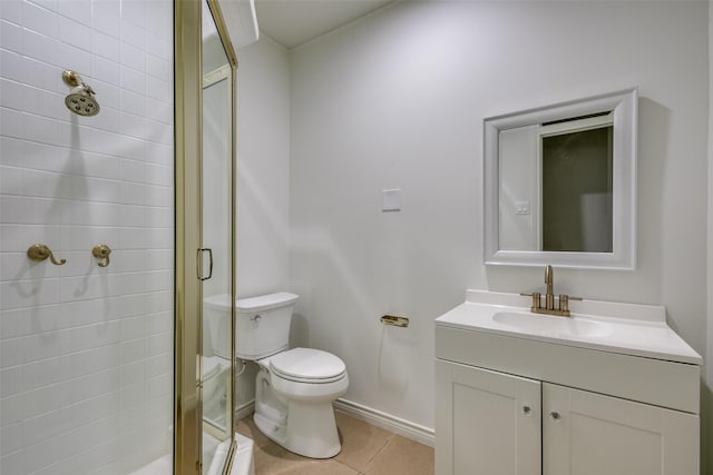 bathroom featuring tile patterned flooring, vanity, toilet, and walk in shower