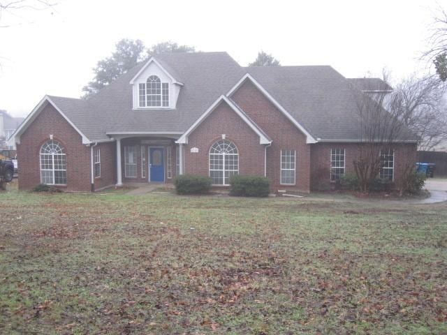 view of front of home with a front yard