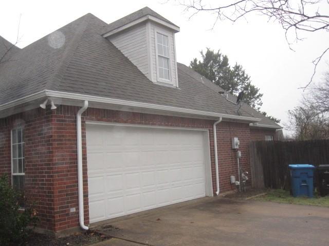 view of property exterior with a garage