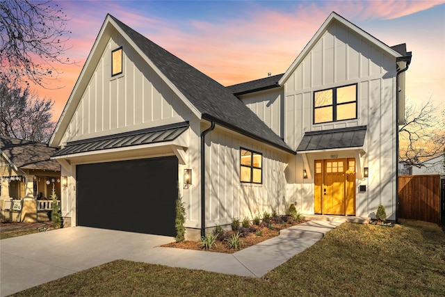 modern inspired farmhouse with a garage