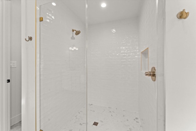 bathroom with tiled shower