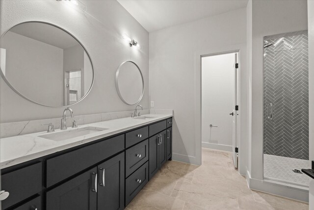 bathroom featuring vanity and an enclosed shower