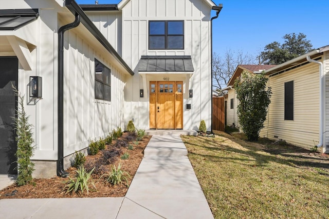 doorway to property with a yard