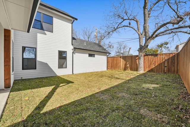 back of house with a yard