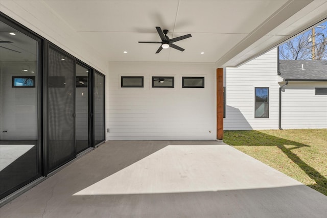 view of patio featuring ceiling fan