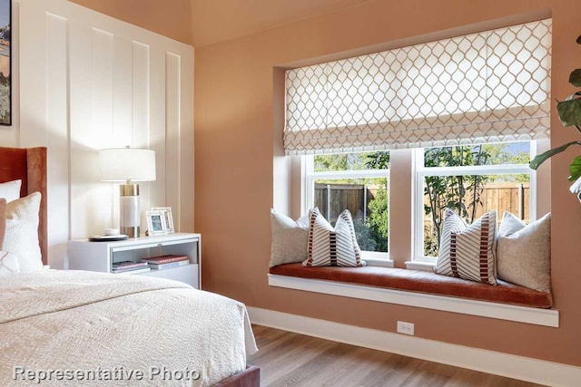 bedroom with light wood-type flooring