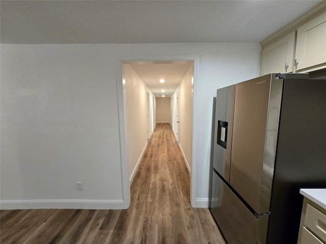 corridor featuring light hardwood / wood-style floors