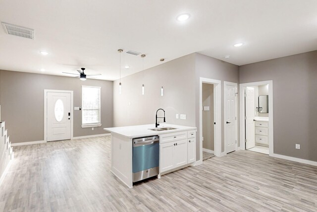 kitchen featuring stainless steel appliances, light wood-type flooring, decorative backsplash, and white cabinets