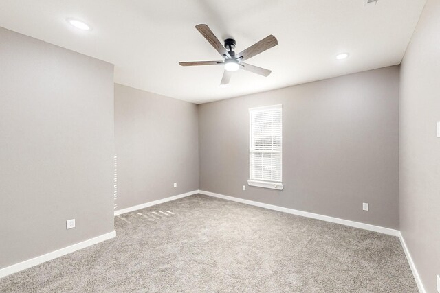 empty room with carpet floors and ceiling fan