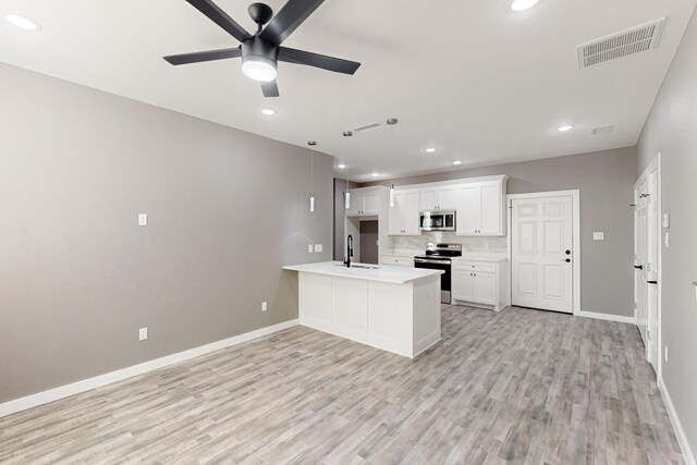 foyer entrance featuring ceiling fan and light hardwood / wood-style floors