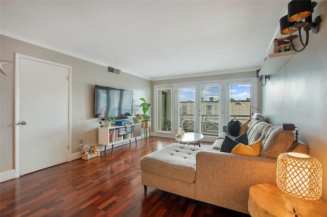 living room featuring baseboards, dark wood-style flooring, visible vents, and crown molding