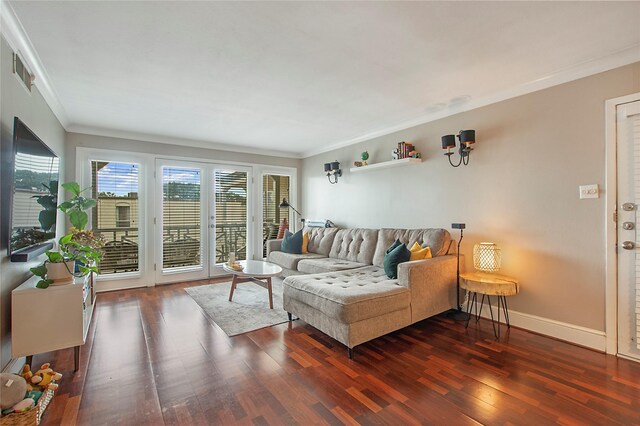 dining space with crown molding, dark wood finished floors, and baseboards