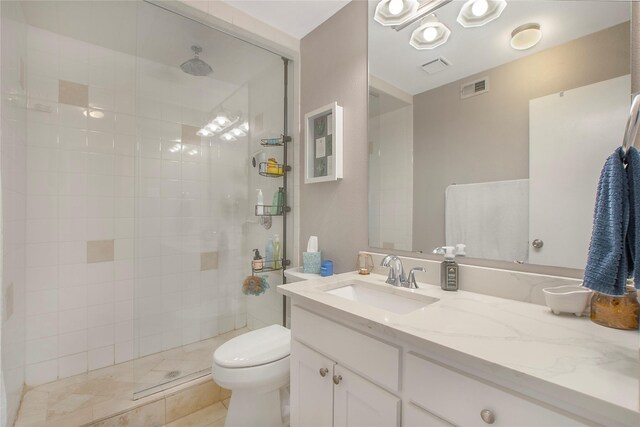 full bathroom featuring toilet, tile patterned flooring, vanity, and visible vents