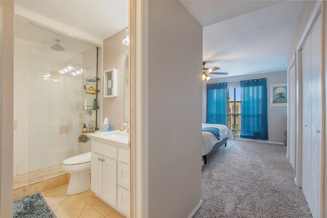 bedroom with carpet floors, ceiling fan, and baseboards