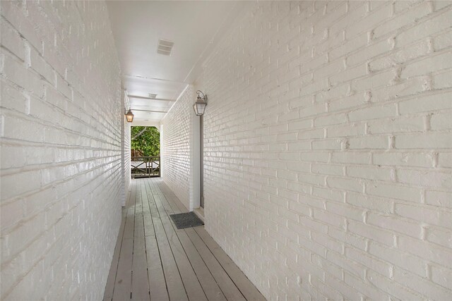 bathroom with toilet, visible vents, tiled shower, and vanity