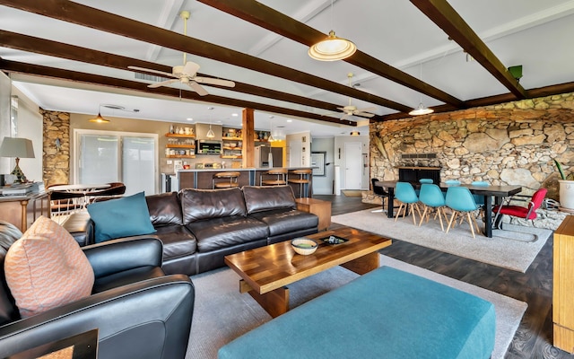 living room with vaulted ceiling with beams and hardwood / wood-style floors