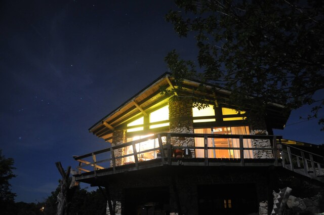 view of property exterior at night